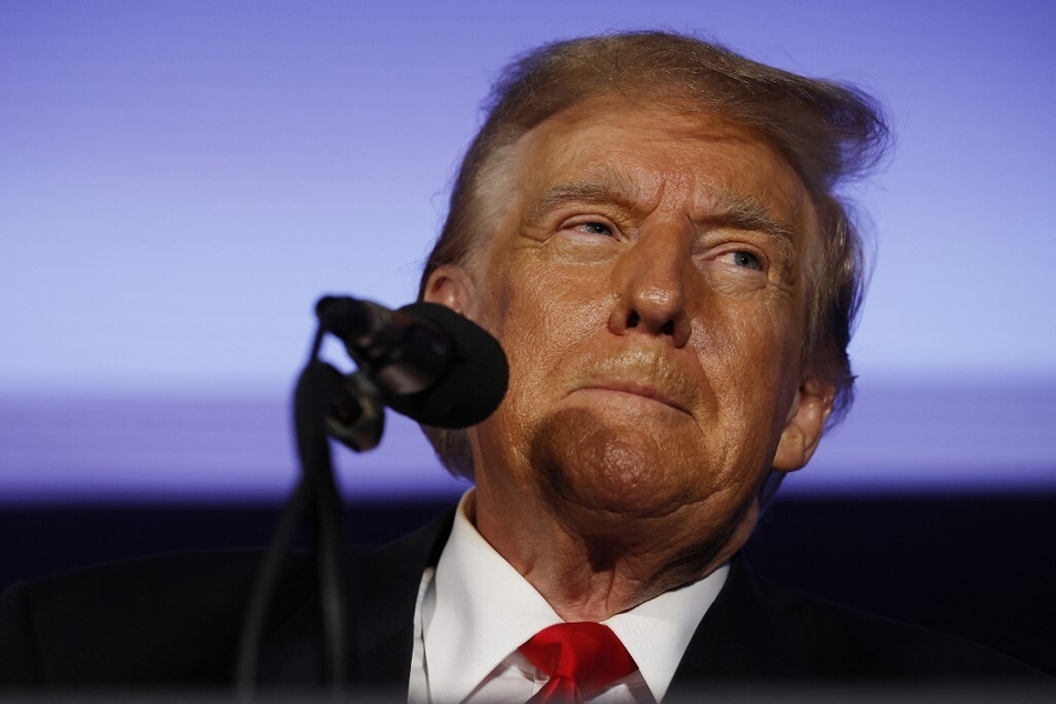 Former president and 2024 Republican candidate Donald Trump talks to supporters during a campaign rally on January 17, 2024, in Portsmouth, New Hampshire.