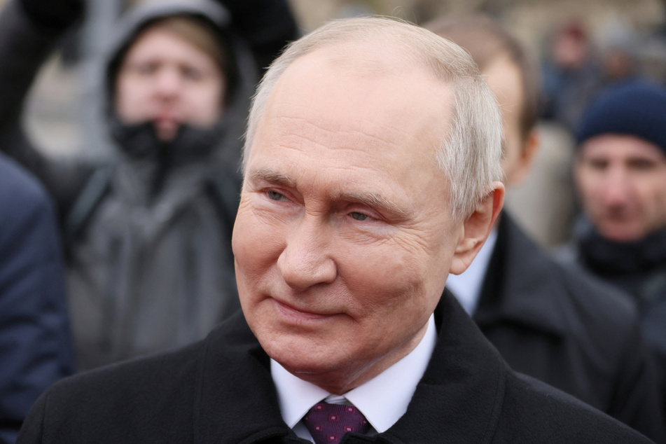 Russian President Vladimir Putin speaks with members of public associations while marking Russia's Day of National Unity in Moscow on November 4, 2023.