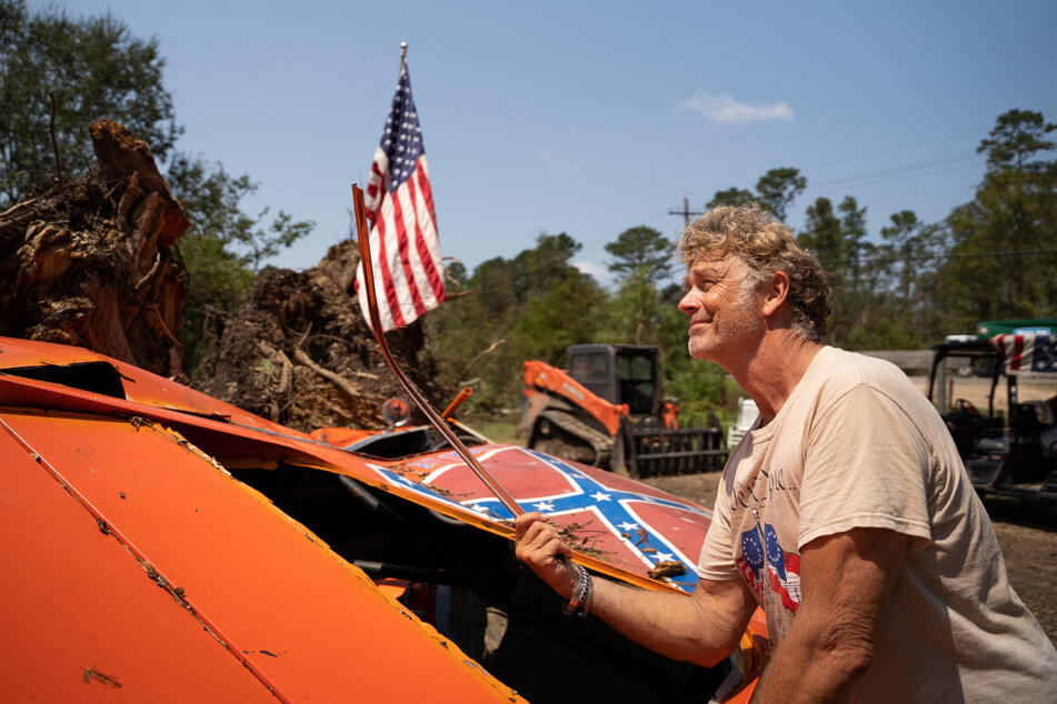 Schneider later denied calling for "an act of violence" against the US president.