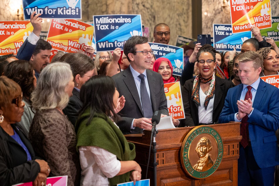 Washington Governor Bob Ferguson announces the enactment of a Millionaire's Tax during a ceremony at the State Capitol in Olympia on March 30, 2026.
