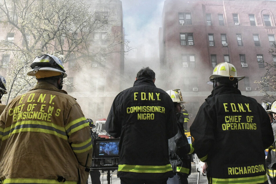 Hundreds of firefighters are battling a devastating apartment building blaze in Queens