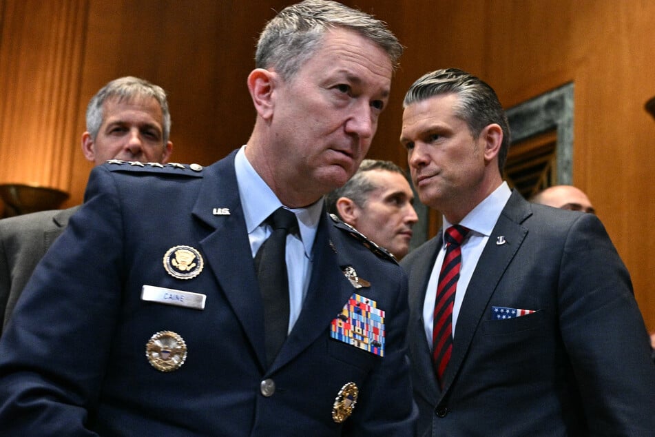 Chairman of the Joint Chiefs of Staff General Dan Caine (l) and Defense Secretary Pete Hegseth (r) arrive for a Senate Committee on Appropriations on May 12, 2026.