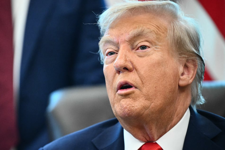President Donald Trump speaks to the press after signing an executive order that aims to end cashless bail, in the Oval Office of the White House in Washington, DC on Monday.