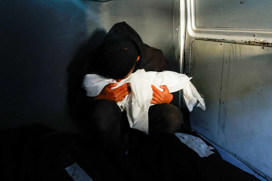 A funeral for Palestinian twins Wesam and Naeem Abu Anza, who were born during the conflict between Israel and Hamas and were killed in Israeli air strikes, in Rafah on Sunday.