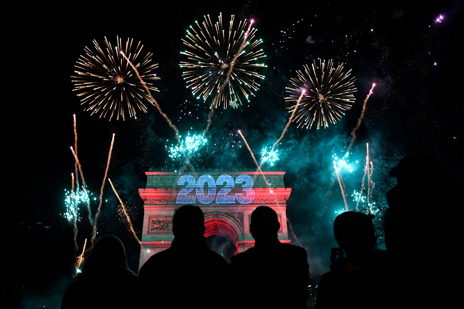 Around one million people celebrated the turn of the year with a huge fireworks display on the Champs-Élysées in Paris.
