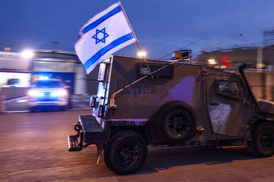 Israeli security forces are seen outside Ofer military prison located between Ramallah and Baytunia in the occupied West Bank city amid preparations for the release of Palestinian prisoners in exchange for Israeli hostages held by Hamas in Gaza on November 25, 2023.