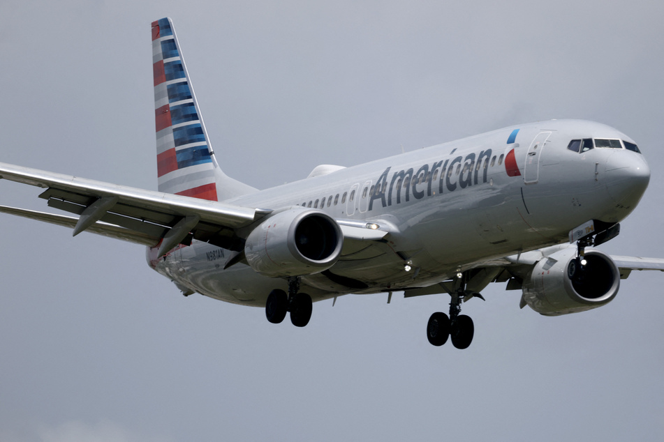 An American Airlines plane lands at the Miami International Airport in Florida.