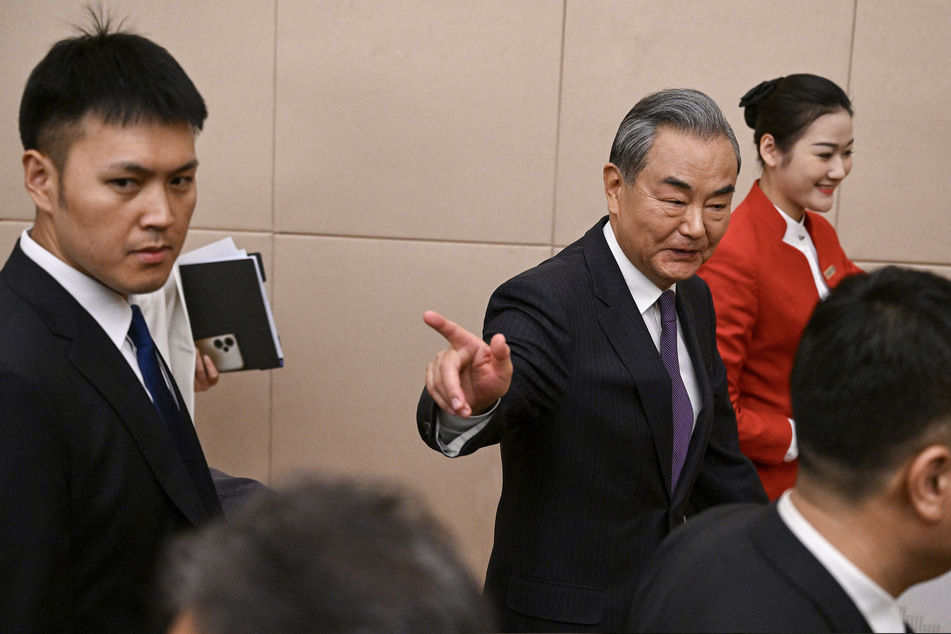 During a press conference, Chinese foreign minister Wang Yi said that Beijing was ready to step up and provide leadership on the world stage.