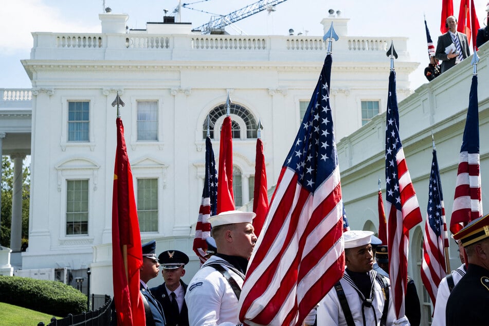 US military guard members gather near the White House for rehearsals before Chinese President Xi Jinping's visit to Washington this week.