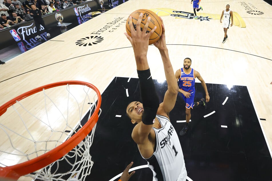 San Antonio Spurs forward Victor Wembanyama dunks the ball during game five of the 2026 NBA Finals at Frost Bank Center.