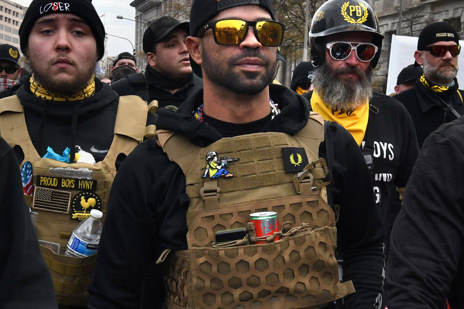 Tarrio (c.) marches with fellow Proud Boys during a December demonstration to overturn the 2020 presidential election results.