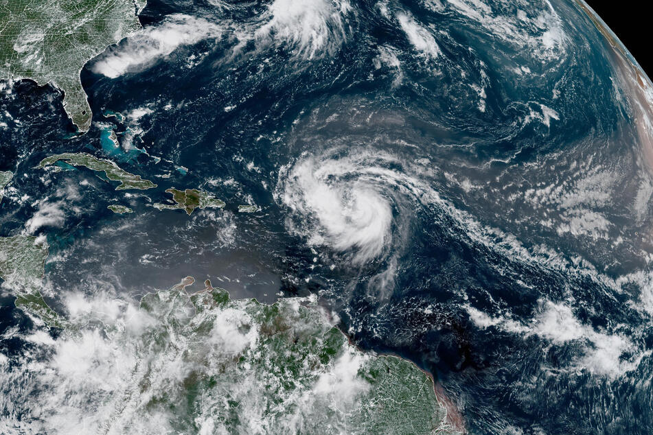 This satellite image provided by the National Oceanic and Atmospheric Administration (NOAA) shows Hurricane Erin forming in the Atlantic Ocean on Friday.