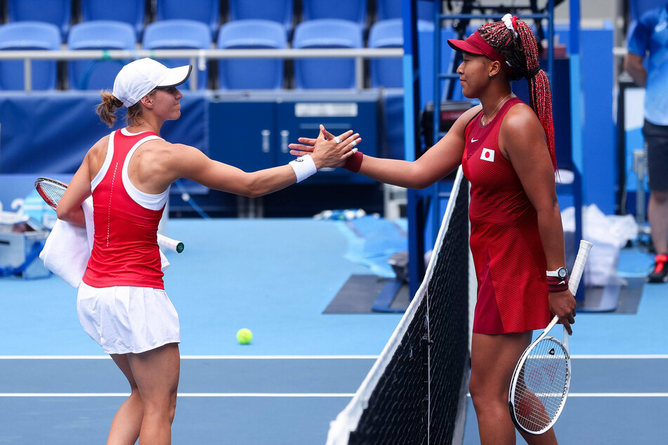 Osaka (r.) defeated Golubic during their women's second round tennis match on Monday.