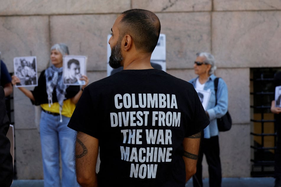 An activist wears a t-shirt calling for divestment during a pro-Palestine protest outside Columbia University gates on September 14, 2026.