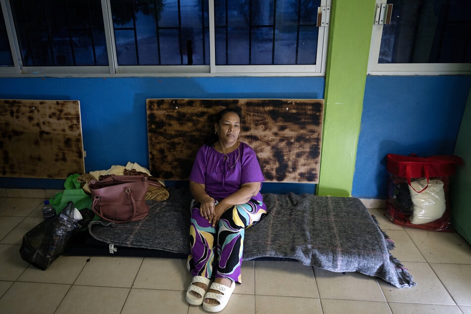 Maria Palomino rests at a school serving as a refuge for residents in Puerto San Carlos, Baja California Sur, ahead of the arrival of Hurricane Polo on September 28, 2026.