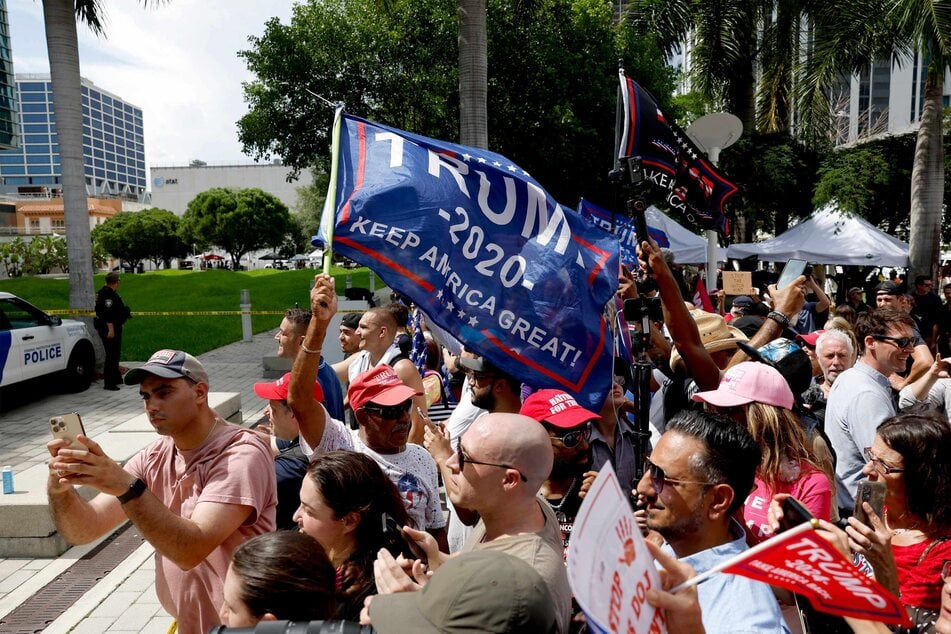 Donald Trump's supporters outside the Miami federal courthouse during his arraignment earlier this month, where he pleaded not guilty to 37 federal charges including possession of classified documents.