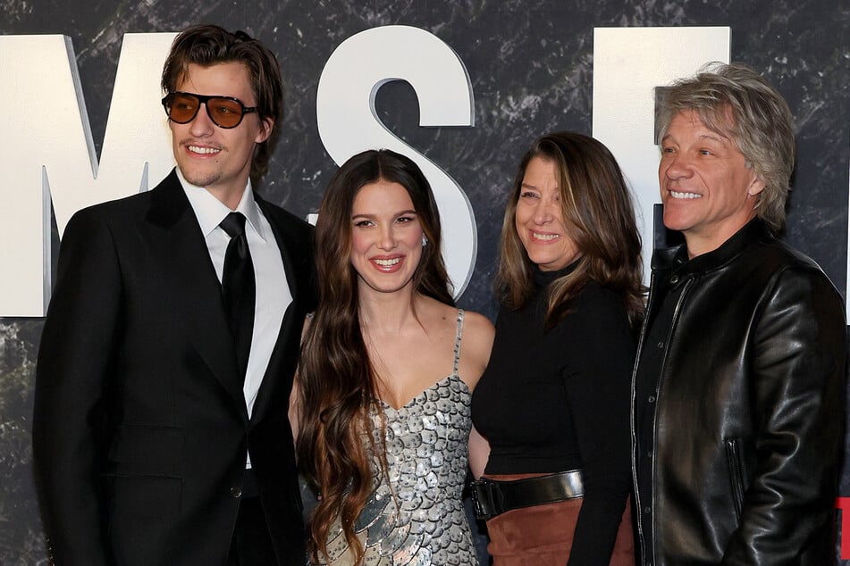 Millie Bobby Brown (second from l.) shared that she's open to taking her fiancé Jake Bongiovi's (l.) last name after their wedding.