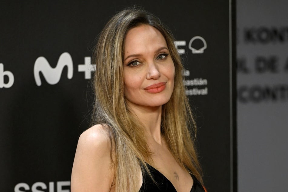Angelina Jolie posed for TIME France with a look at her mastectomy scars for the first time in over ten years.
