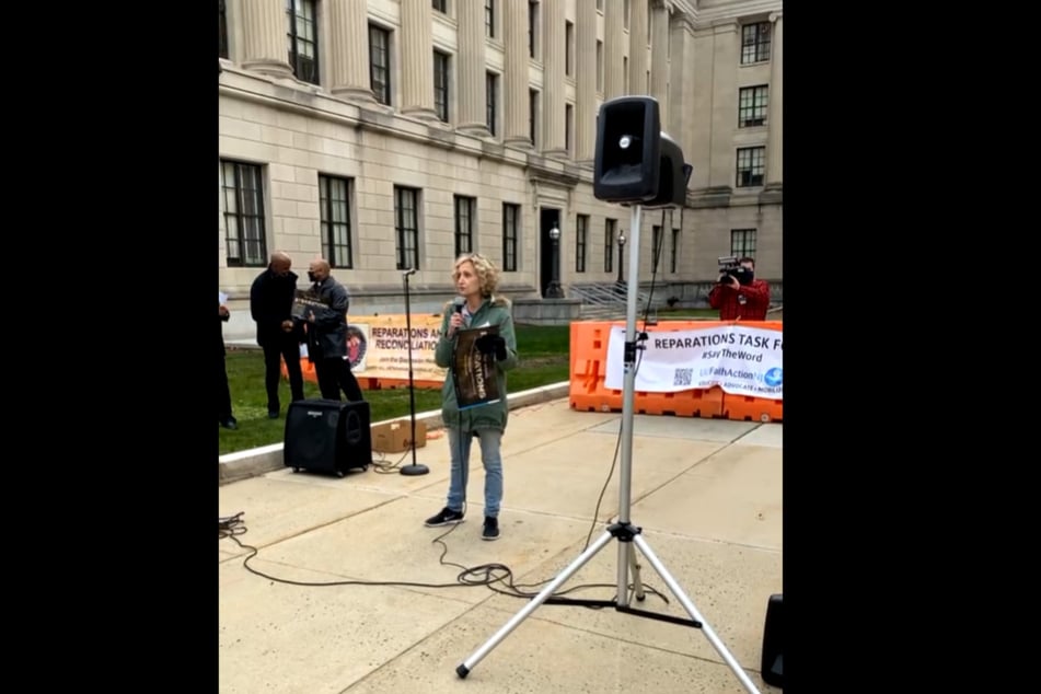 NJISJ Communications Director Laurie Beacham speaks at the Say the Word rally.