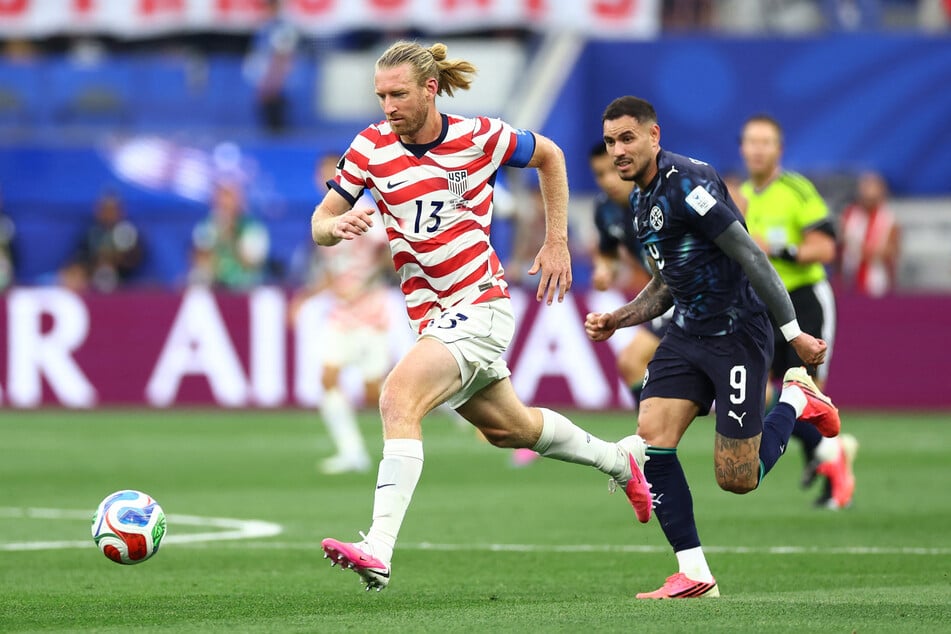 Tim Ream in action with Paraguay's Antonio Sanabria in their Group D match on June 12, 2026.