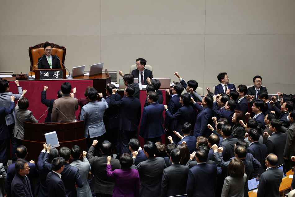 South Korean lawmakers voted to impeach acting president Han Duck-soo amid chaotic scenes on Friday.