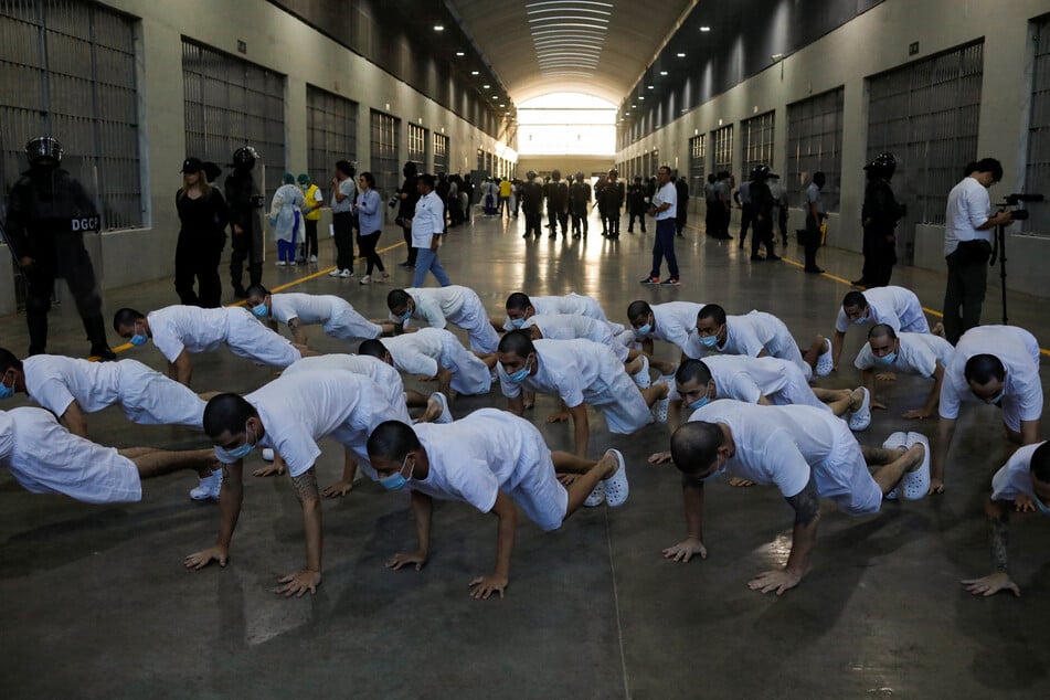 Hundreds of people have been deported to El Salvador, where they are held in horrific condition in a maximum-security prison.