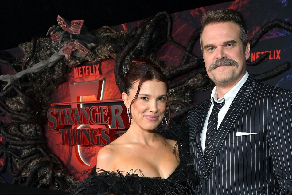 David Harbour (r) opened up on his relationship with Millie Bobby Brown (l) following the alleged complaint she filed against him.