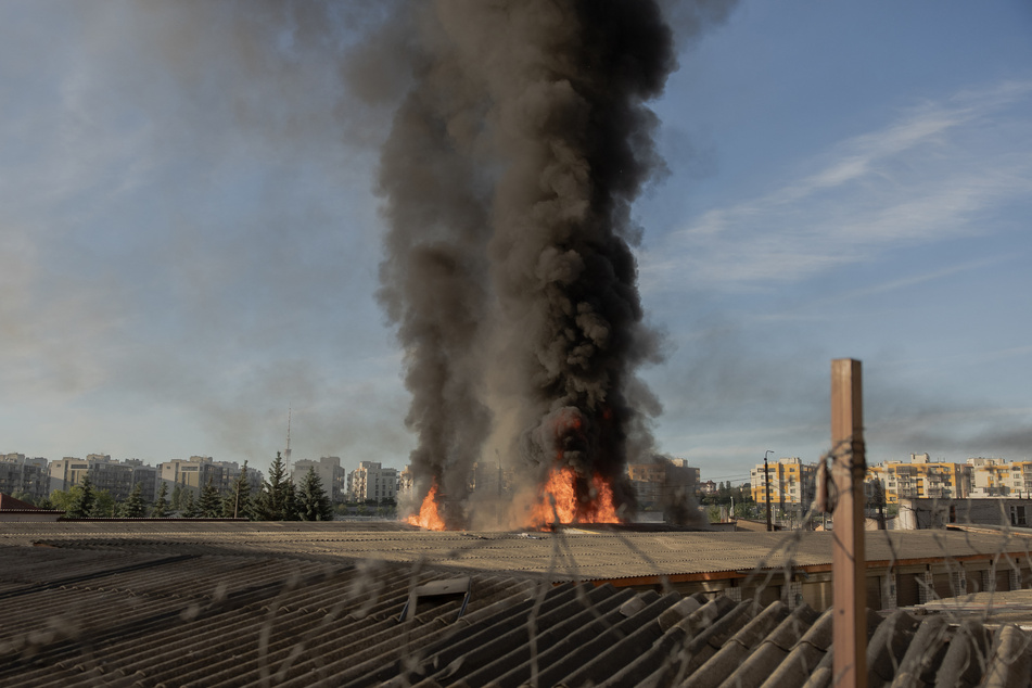 Smoke and flames rise from garages damaged during a Russian missile and drone strikes in Kyiv, Ukraine, on June 2, 2026.