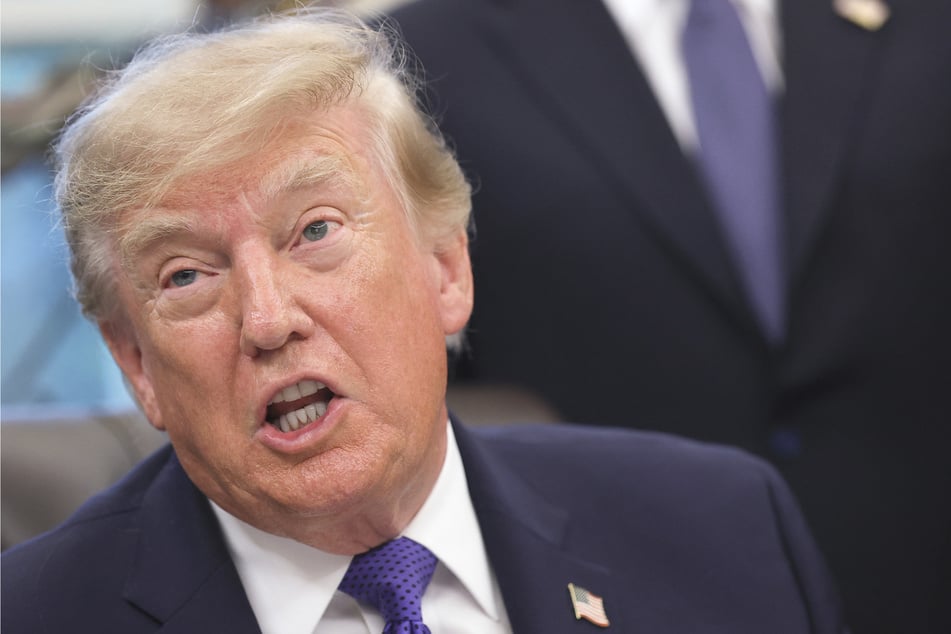 President Donald Trump delivers remarks in the Oval Office at the White House on Monday. Trump officials have pushed back at criticisms of his ads, claiming that they are "educational and unapologetically patriotic."