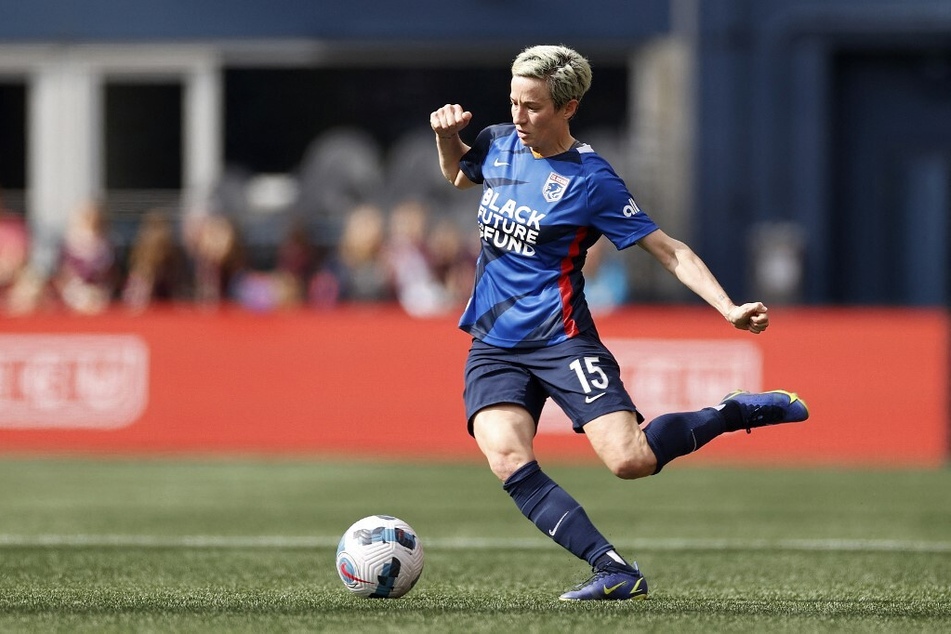 Megan Rapinoe of OL Reign passes against the Washington Spirit.