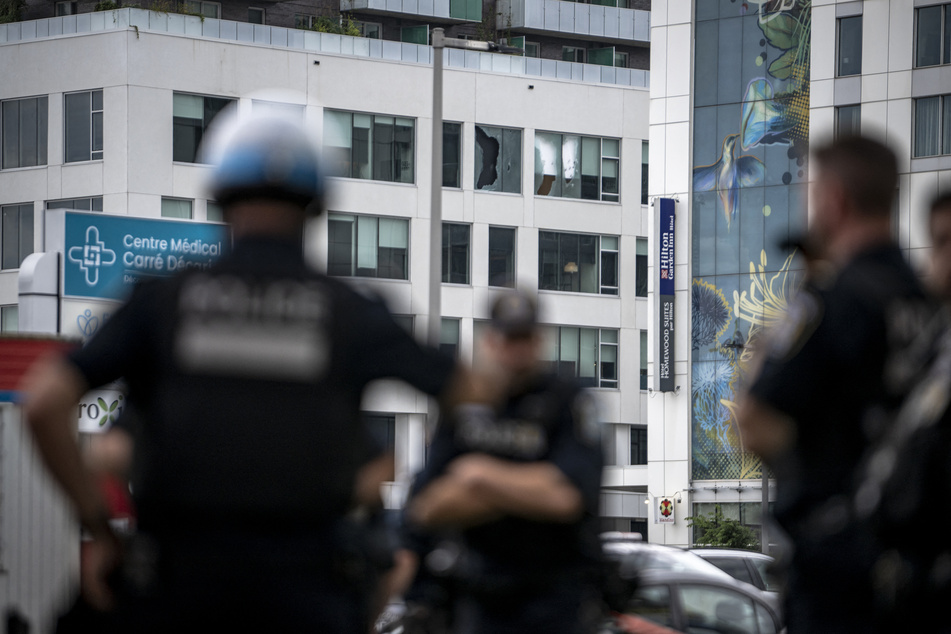 Windows are seen shot out at the scene of an earlier active shooter situation in Montreal, Canada, on June 22, 2026.