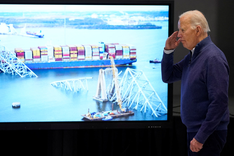 President Joe Biden salutes as he visits the Maryland Transportation Authority Police Headquarters near the collapsed Francis Scott Key Bridge, in Dundalk, Maryland.