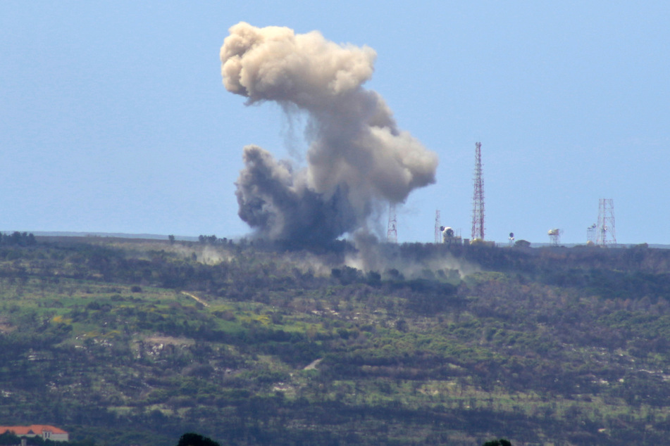 A picture taken from the southern Lebanese village of Alma al-Shaab shows smoke rising from an Israeli outpost after a rocket attack by Lebanon's Hezbollah movement fighters on April 6.
