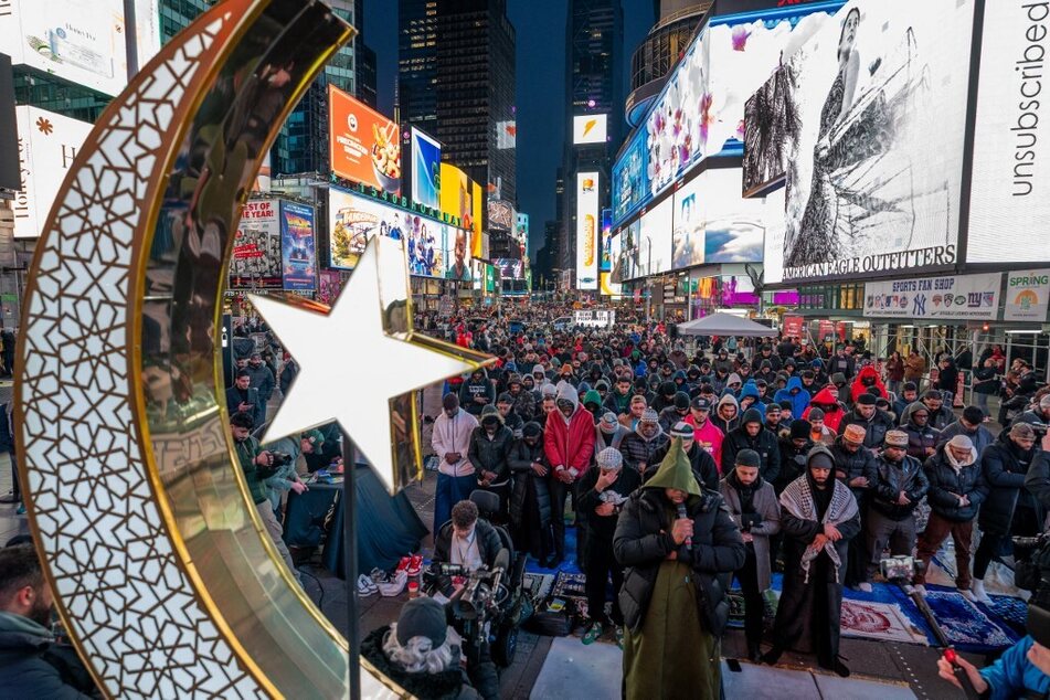 Members of the Muslim community gather in New York City's Times Square for the first Taraweeh prayer of Ramadan on March 10, 2024.