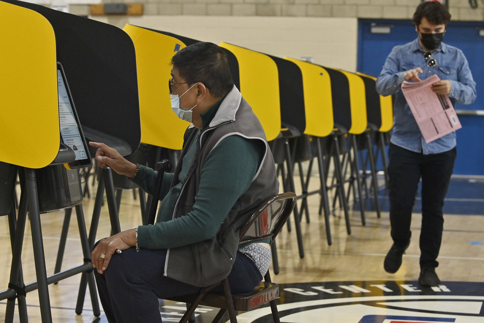 Voters cast their ballots in California's gubernatorial recall election on Tuesday. Voters are being asked two questions on their recall ballots: The first is whether Gov. Gavin Newsom should be recalled, and the second is who should succeed him in the event he is.