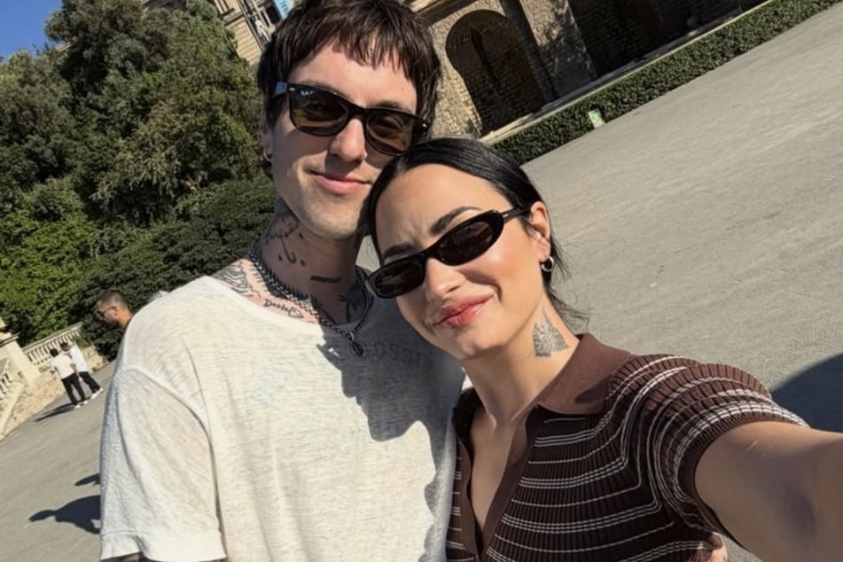 Demi Lovato says "communication" and creating a "safe space" is what keeps her marriage to Jutes (l) strong after celebrating their one-year anniversary.
