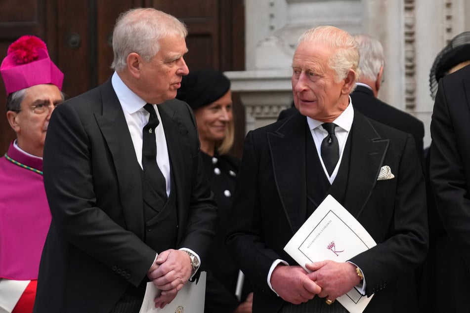King Charles (r.) insisted that the "law must take its course" after his younger brother, Andrew, was arrested in February. The monarch stripped Andrew of his royal titles months before the arrest.