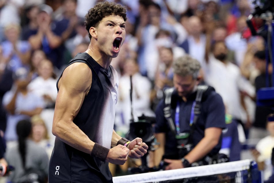 Ben Shelton celebrates winning his US Open quarter-final match against Spain's Carlos Alcaraz on September 9, 2026.