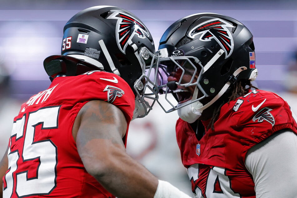 Za'darius Smith #55 (l.) reacts with Brandon Dorlus #54 of the Atlanta Falcons during a game against the Chicago Bears on October 18 in Atlanta, Georgia. The Falcons' new "throwback" logo has gone viral online – for all the wrong reasons!