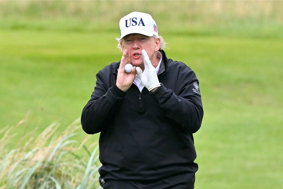 Social media users have been speculating whether a viral video of Donald Trump shows the US president cheating at a game of golf while in Scotland.