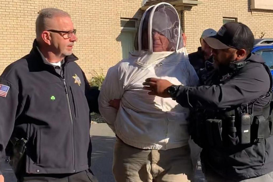 Rorie S. Woods donned a beekeeping costume before unleashing the bees on officers at the scene.