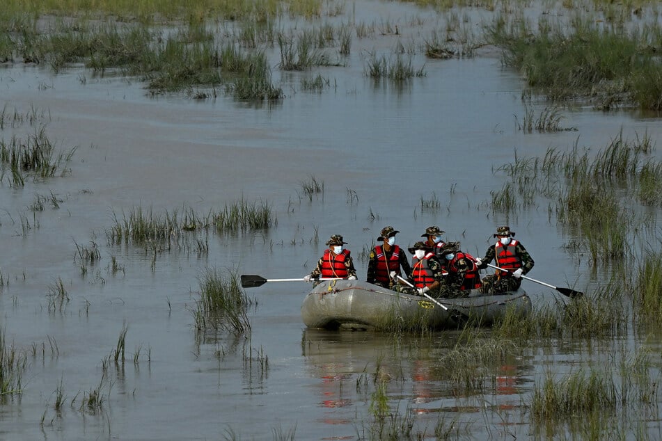 Army personnel conduct a search and rescue operation for flood victims along the Narayani River at Bharatpur in Nepal's Chitwan district on August 30, 2026.