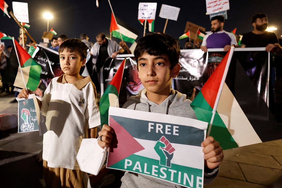 People participate in a protest to mark Land Day and to show their support with Gaza, in Baghdad, Iraq.