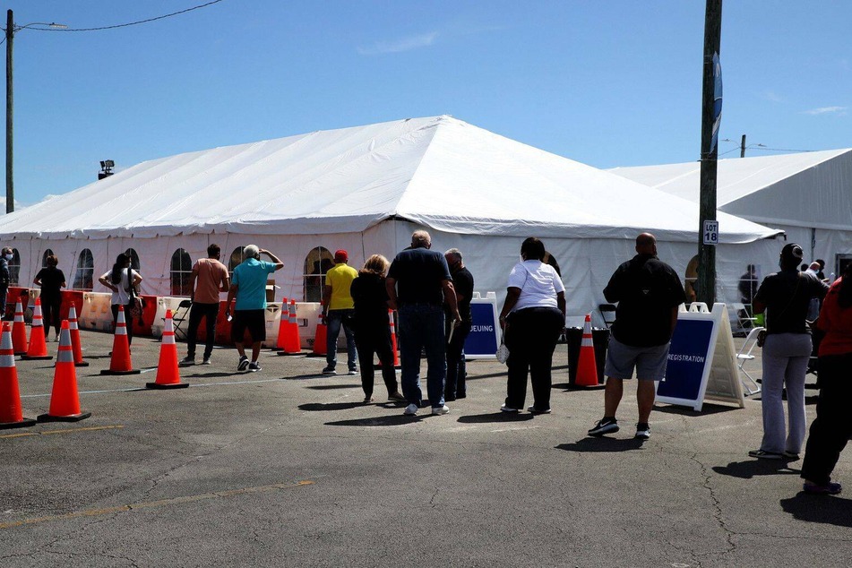 People waiting to be vaccinated at a federally supported vaccination site at Miami Dade College in Florida.