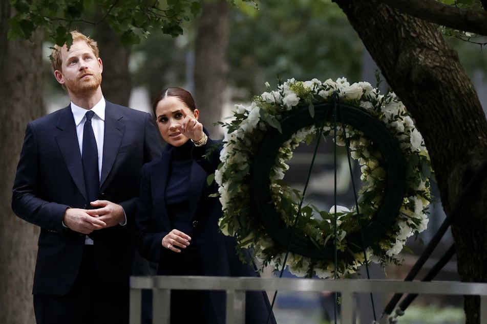 Prince Harry and Meghan stop to view a wreath at the 9/11 Museum at Ground Zero.