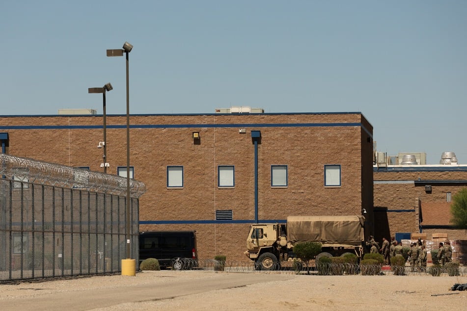 California National Guard troops load a truck outside the Adelanto US Immigration and Customs Enforcement detention camp near Los Angeles.