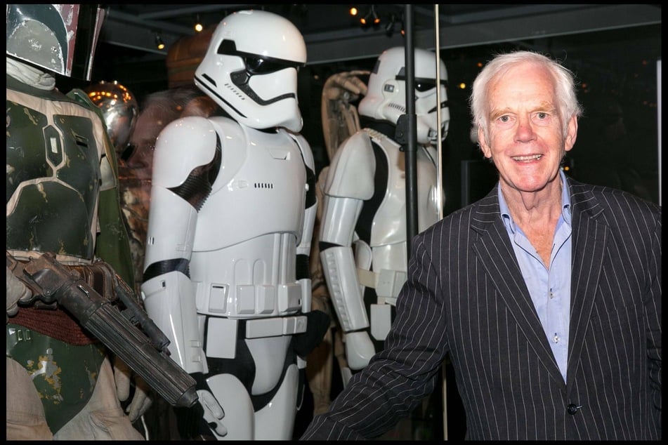 Jeremy Bulloch poses next to his original costume at the 2017 Star Wars Identities: The Exhibition event in London (archive photo).