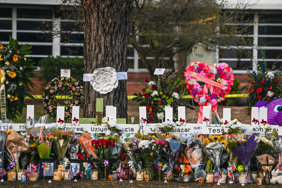 The settlement will also build a memorial to the victims and establish May 24, the day of the shooting, as an annual day of remembrance.