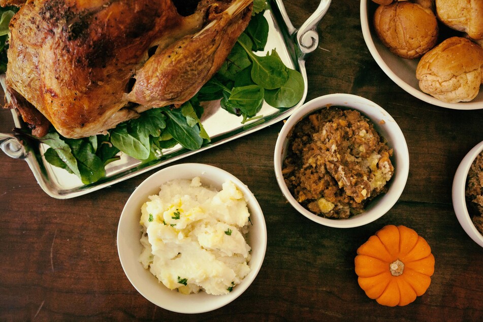 Though your dog may be giving you puppy eyes while begging for bites of your Thanksgiving meal, it's best to get them their own dog-friendly treats.