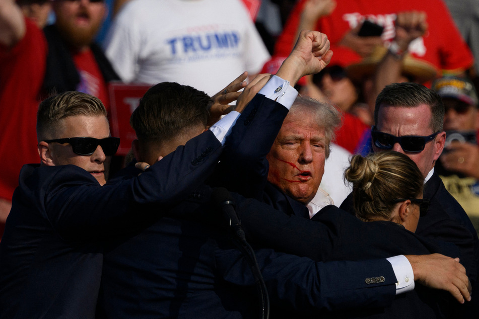 President Donald Trump says "mistakes were made" but he's satisfied with the investigation into his near-assassination a year ago.